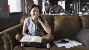 Smiling creative businesswoman in office